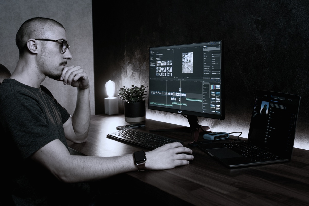 A person at a desk, working through tasks by hand.